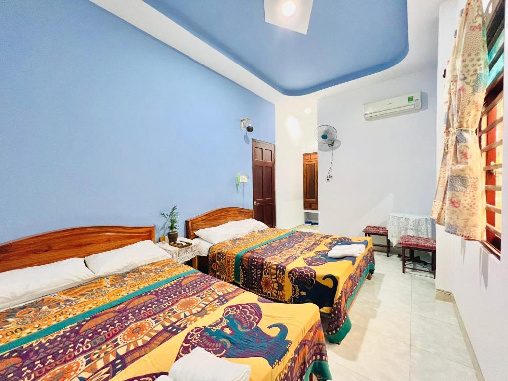 Giường trong phòng chung tại AN Homestay Phan Thiết