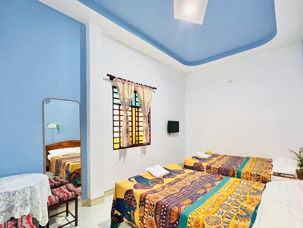Giường trong phòng chung tại AN Homestay Phan Thiết