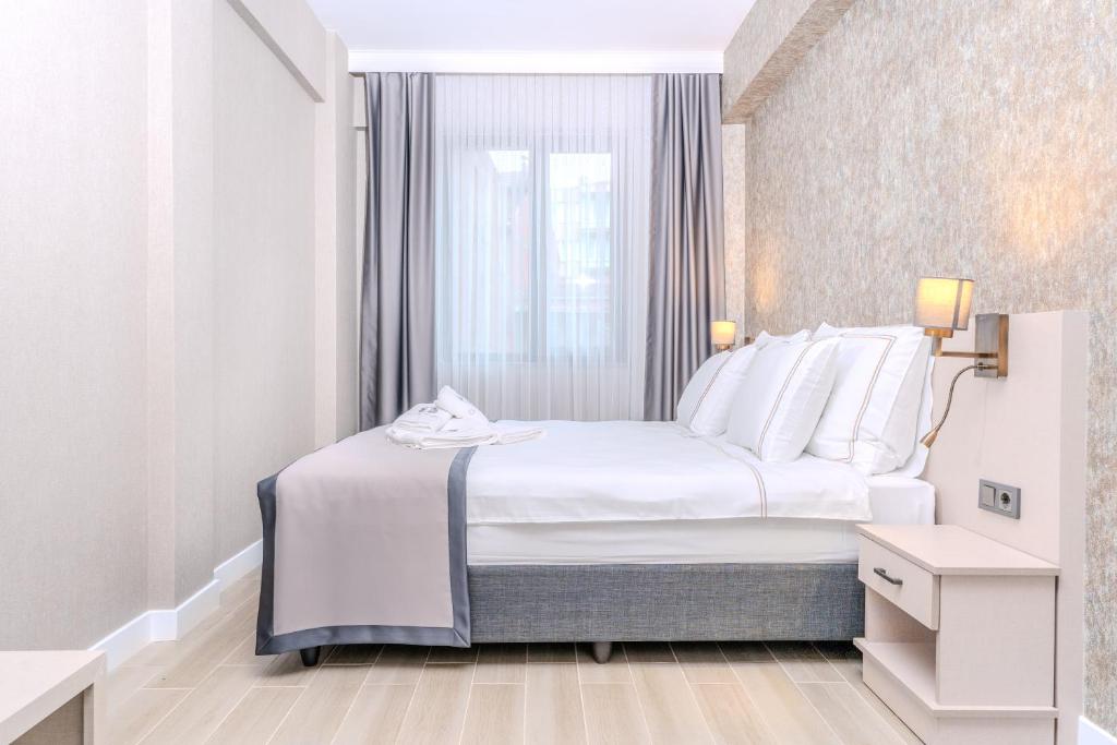 Postel nebo postele na pokoji v ubytování Olea Suites Otel
