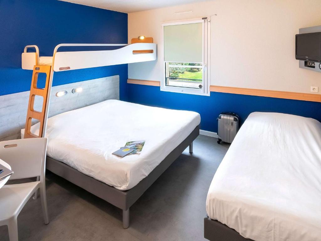 Postel nebo postele na pokoji v ubytování ibis budget Saint-Maximin