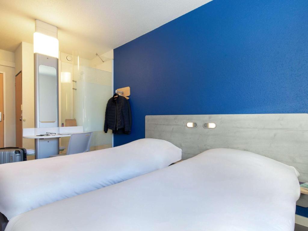 Postel nebo postele na pokoji v ubytování ibis budget Saint-Maximin