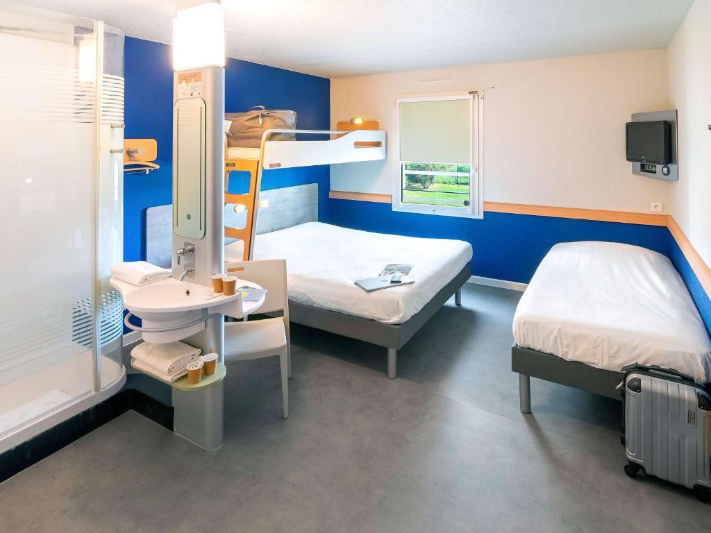 Postel nebo postele na pokoji v ubytování ibis budget Saint-Maximin