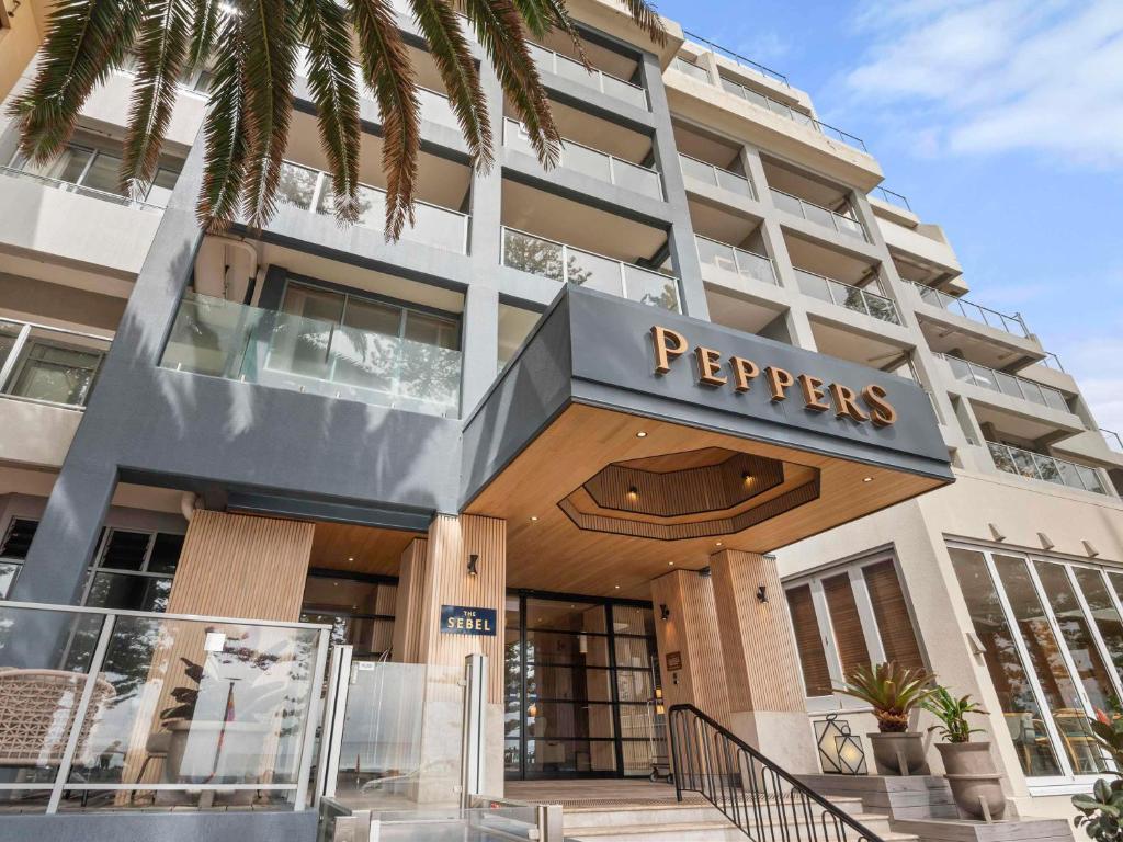 a hotel building with a sign that reads perverts at Peppers Manly Beach in Sydney