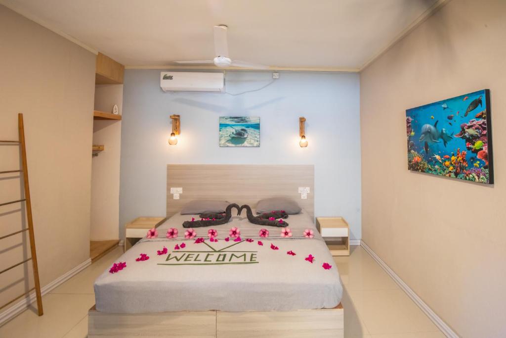 Postel nebo postele na pokoji v ubytování Dive Villa Thoddoo