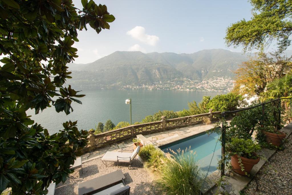 a swimming pool with a view of a body of water at Villa Intreccio in Blevio