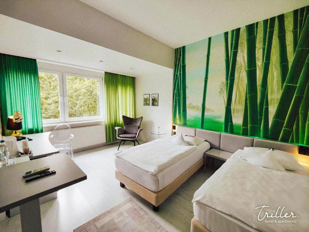 Postel nebo postele na pokoji v ubytování Hotel Am Triller - Hotel & Serviced Apartments