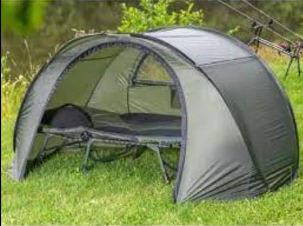 a gray tent sitting in the grass at Namiot near WrocLOVE only place to TENT in Kiełczów