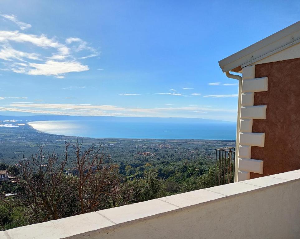 a view of the ocean from the side of a building at Small Exclusive Retreat in Lamezia Terme