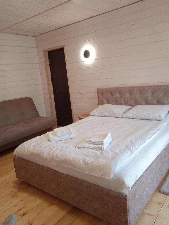 Postel nebo postele na pokoji v ubytování Chalet Ivanna