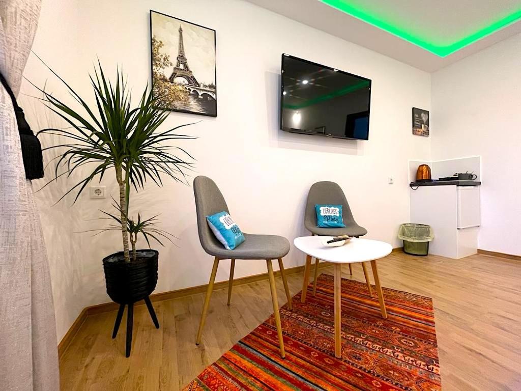 TV a/nebo společenská místnost v ubytování Hotel Uthoff