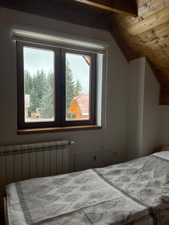 Postel nebo postele na pokoji v ubytování Prika Žika