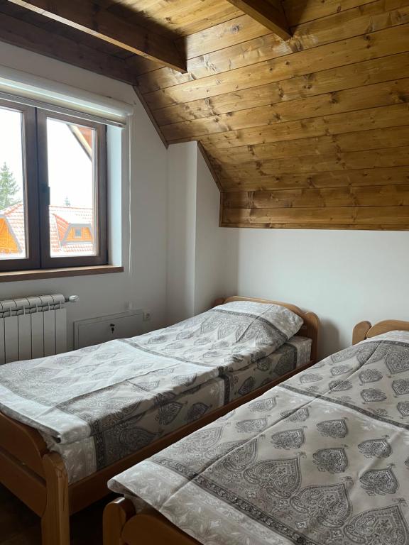 Postel nebo postele na pokoji v ubytování Prika Žika