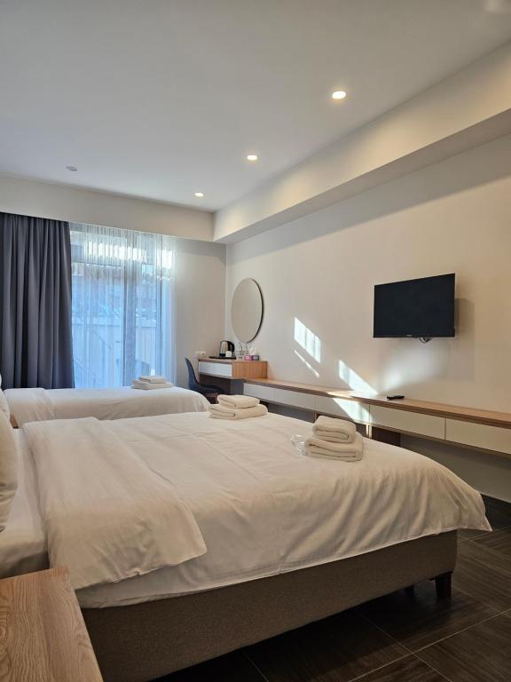 Postel nebo postele na pokoji v ubytování Hotel Avenue 30