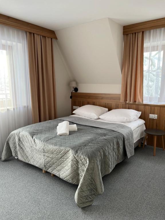 Кровать или кровати в номере Rozetka