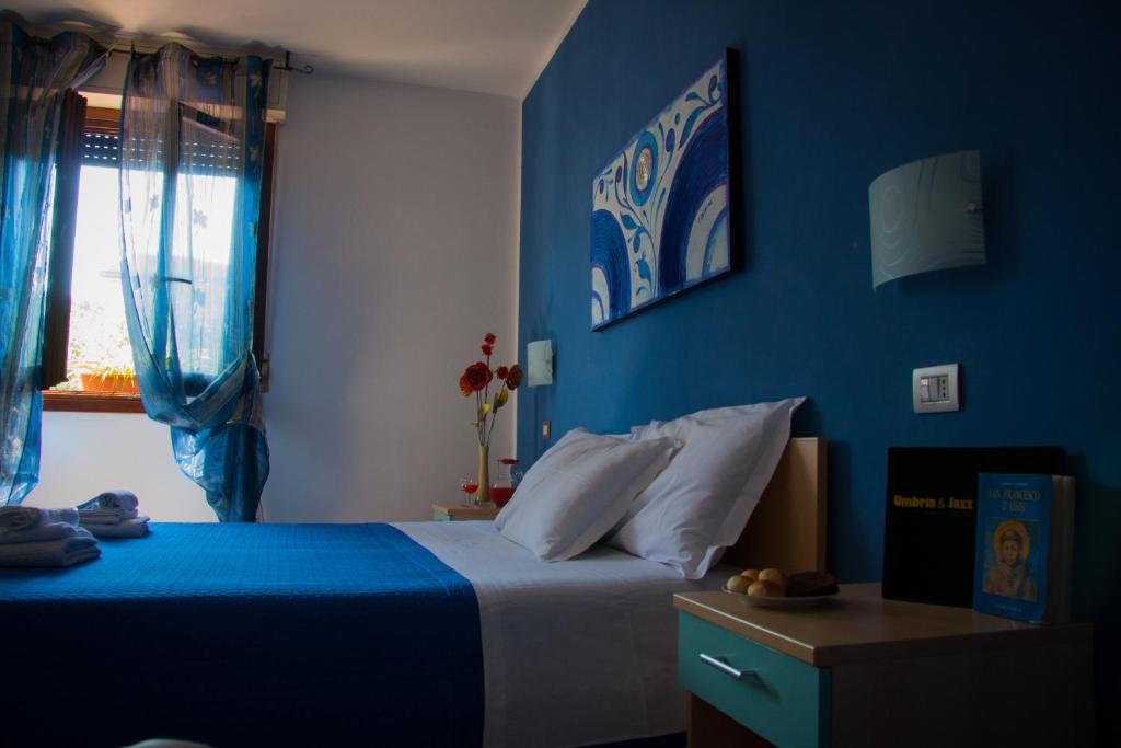 Postel nebo postele na pokoji v ubytování P&P Assisi Camere