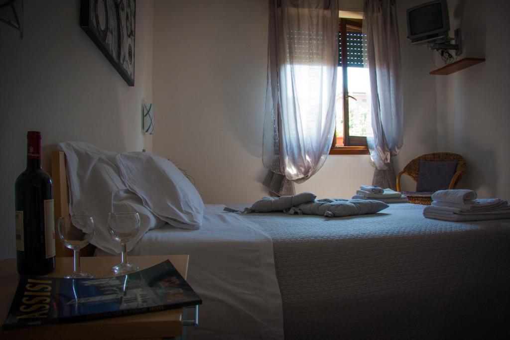 Postel nebo postele na pokoji v ubytování P&P Assisi Camere