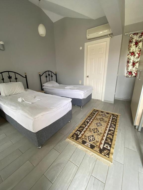 Postel nebo postele na pokoji v ubytování EMAN TERMAL HOTEL