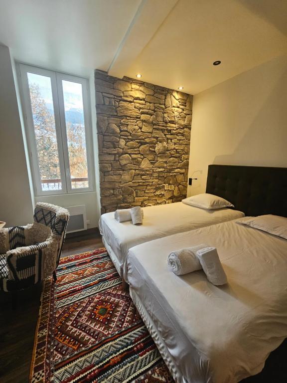 Ein Bett oder Betten in einem Zimmer der Unterkunft Auberge "La Petite Auberge"
