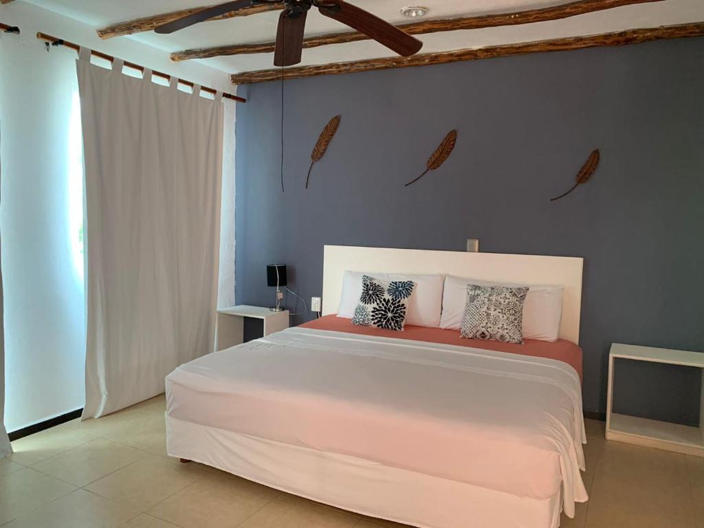 Postel nebo postele na pokoji v ubytování Hotel Arenas Mahahual