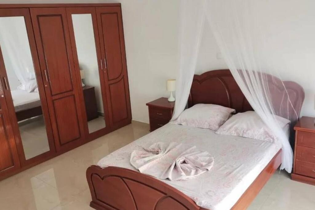 Postel nebo postele na pokoji v ubytování Maison familiale à Tarrafal.