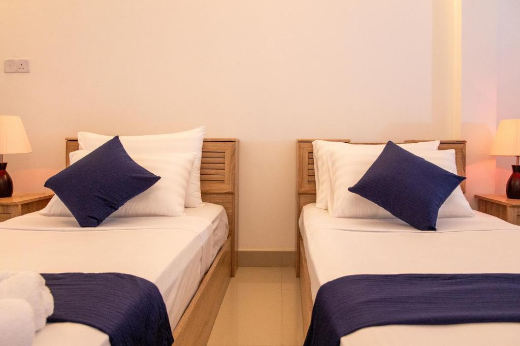 Postel nebo postele na pokoji v ubytování Biosphere Inn