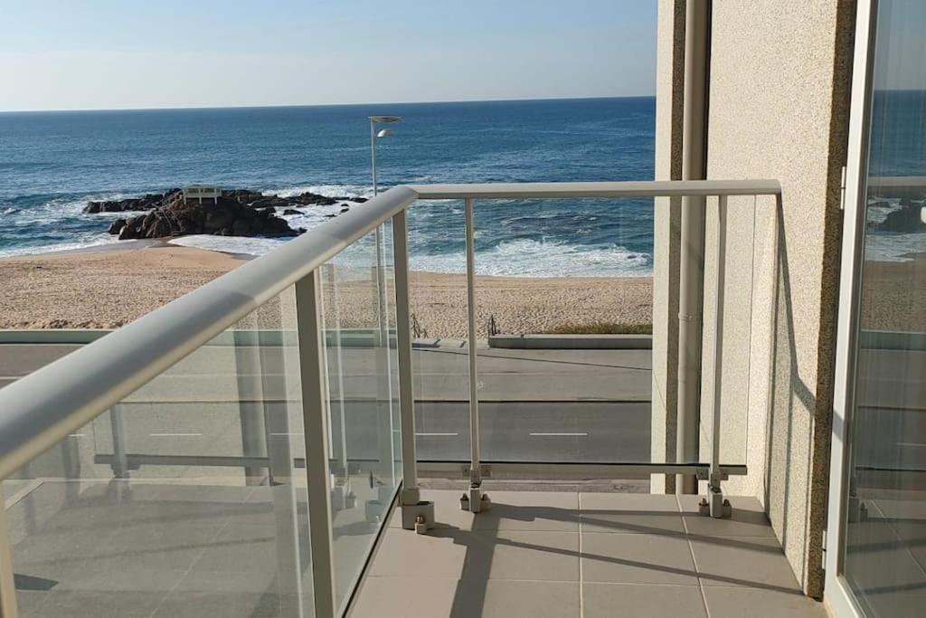 a balcony with a view of a beach and the ocean at Ocean View in Vila do Conde