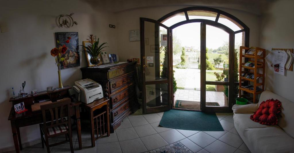 Posezení v ubytování P&P Assisi Camere