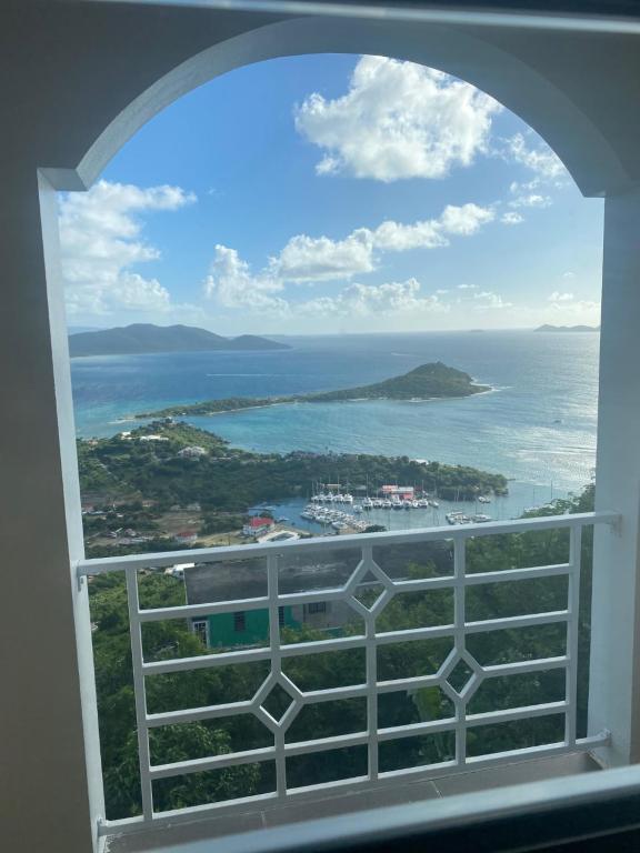 a view of the ocean from a window at Top of the Hill Blue Sunshine in Long Swamp