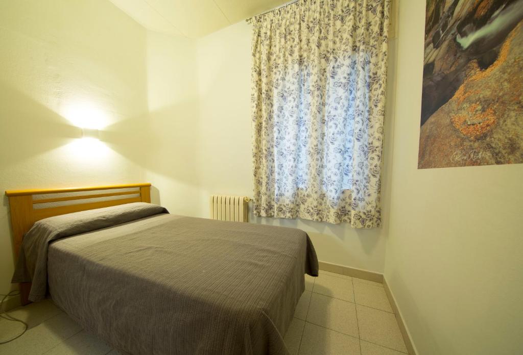 Postel nebo postele na pokoji v ubytování Turó de L´Home