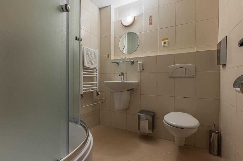 Koupelna v ubytování Grand Hotel rooms