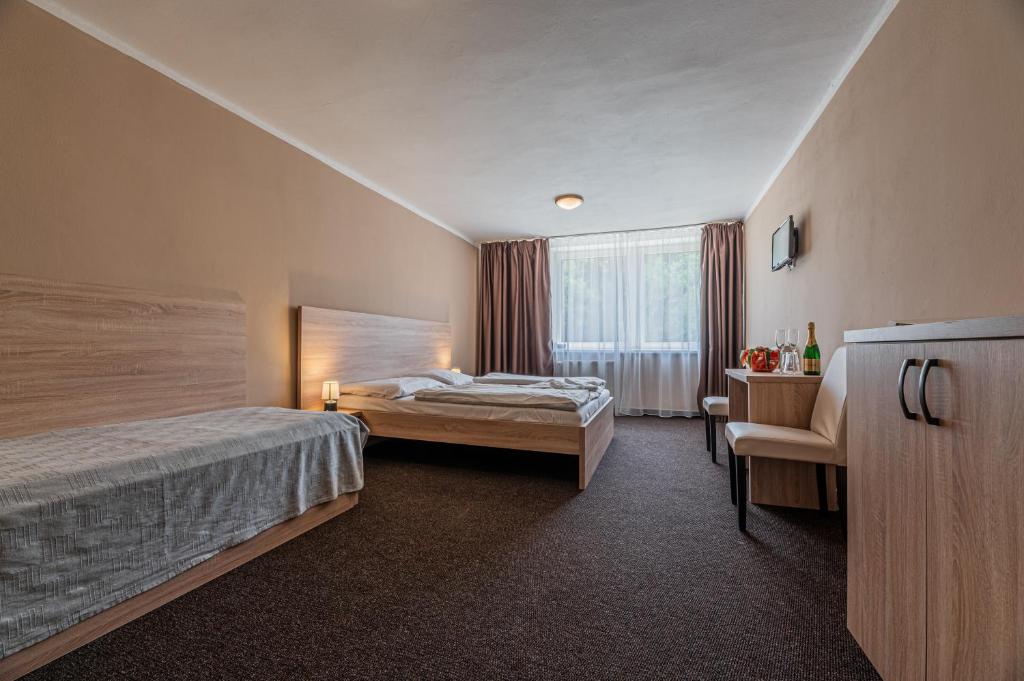 Postel nebo postele na pokoji v ubytování Grand Hotel rooms