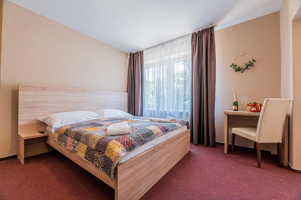 Postel nebo postele na pokoji v ubytování Grand Hotel rooms