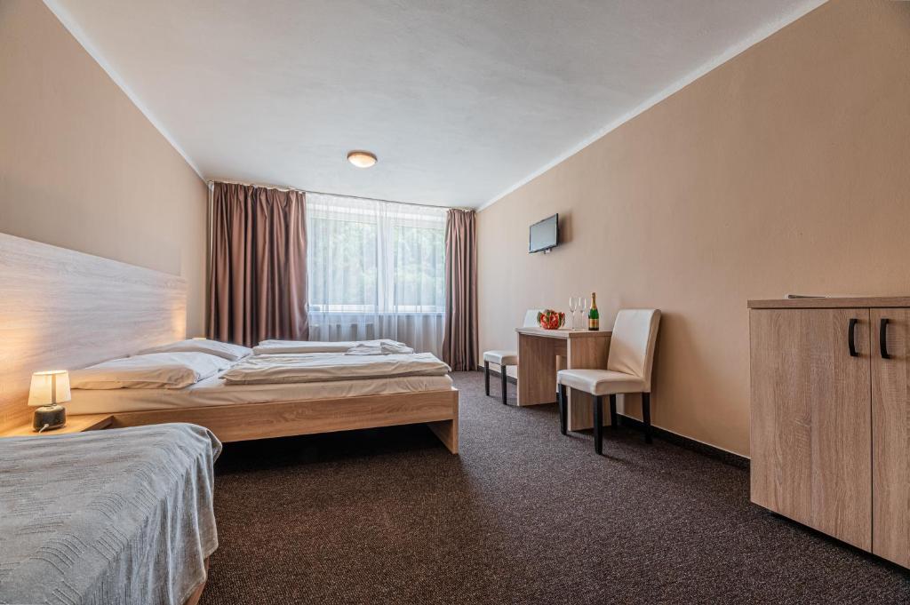 Postel nebo postele na pokoji v ubytování Grand Hotel rooms