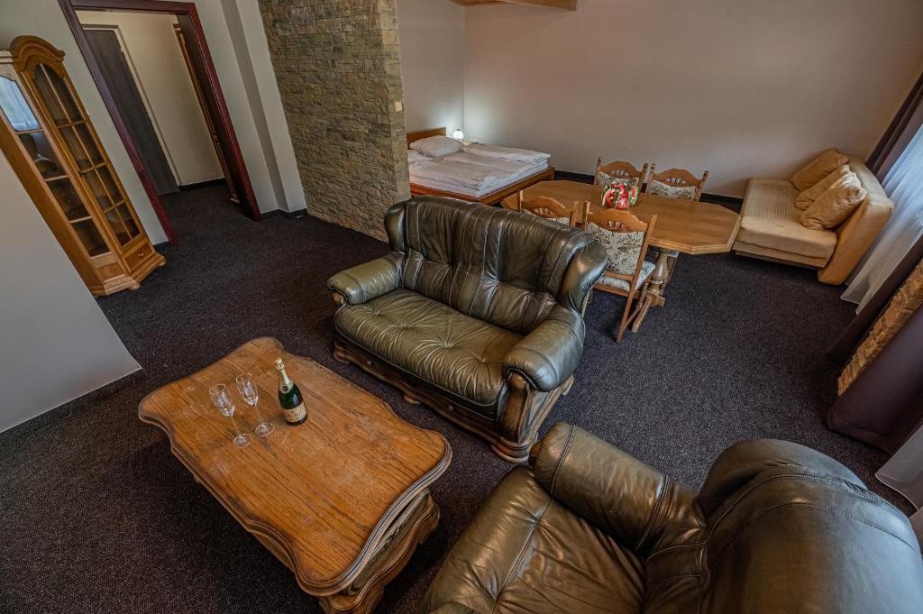 an overhead view of a living room with leather furniture at Grand Hotel rooms in Spišské Tomášovce