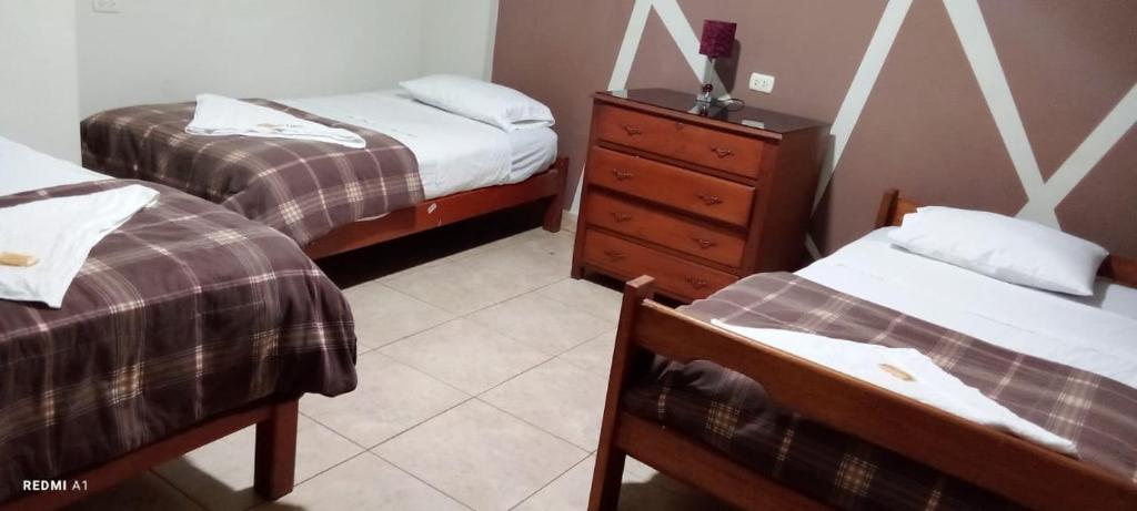 Postel nebo postele na pokoji v ubytování Hotel Santa Lucia - Oficial
