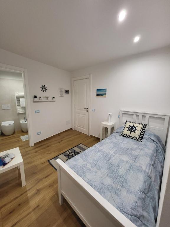 A bed or beds in a room at Affittacamere Il Timone