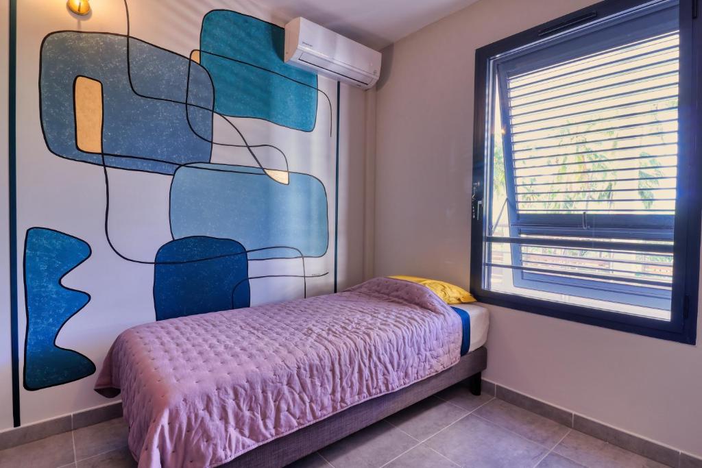Postel nebo postele na pokoji v ubytování Logement 4 pièces Étang St Paul