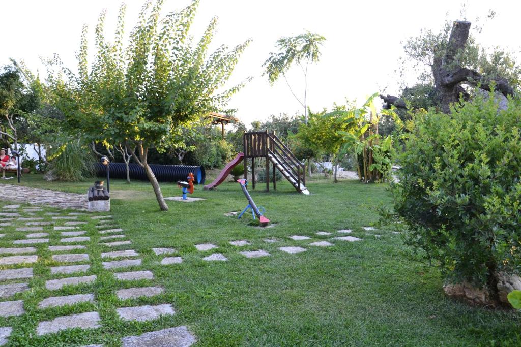 a park with a playground with a swing at B&B SanteBice in Polignano a Mare