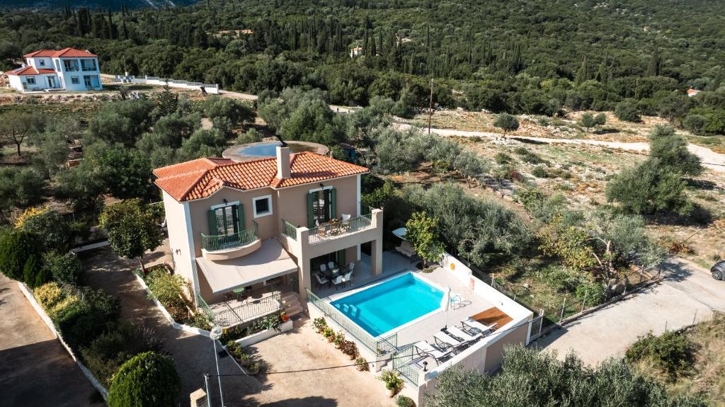 an aerial view of a house with a swimming pool at Scorpios Villa in Kefallonia