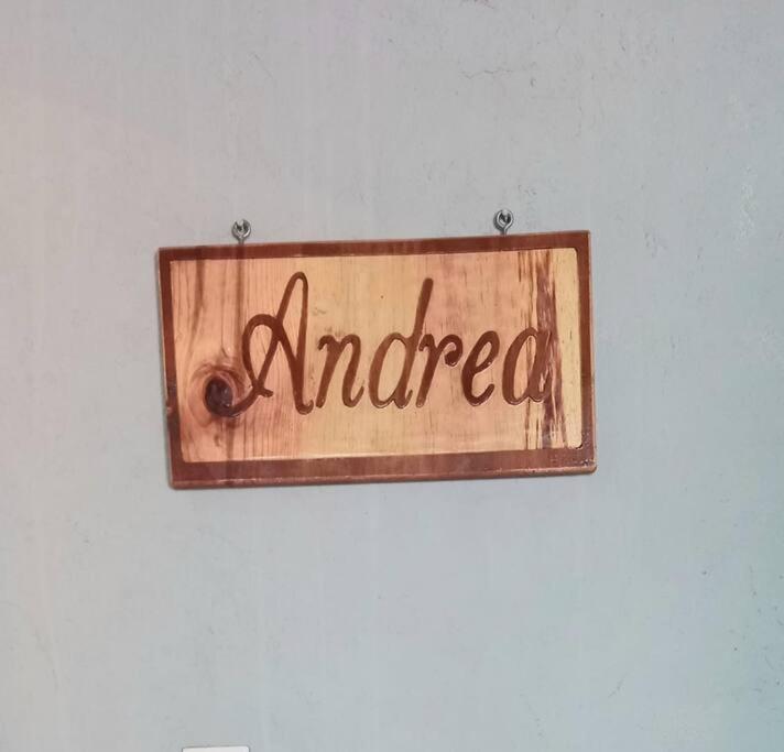 a sign that reads antemed hanging on a wall at Casa Andrea. Crucecita Huatulco. in Santa Cruz Huatulco