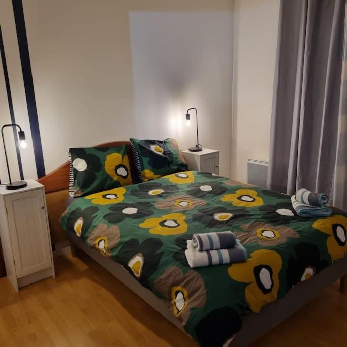 Postel nebo postele na pokoji v ubytování Les Cigognes de Andolsheim