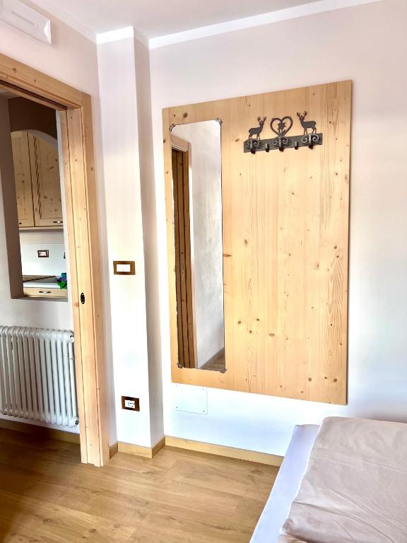 Una cama o camas en una habitación de EMARGHE, CASA A MOENA