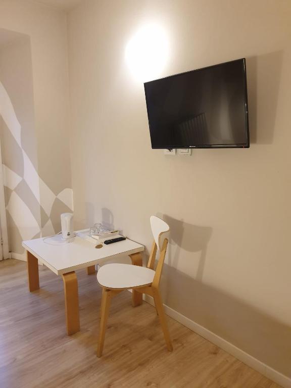 TV a/nebo společenská místnost v ubytování Piccolo Hotel Olina