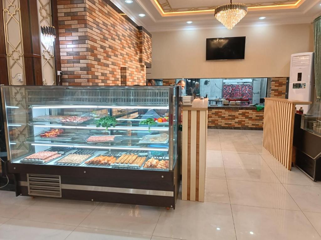 a display case in a bakery with many pastries at Beni Lexury Katyora in Unye