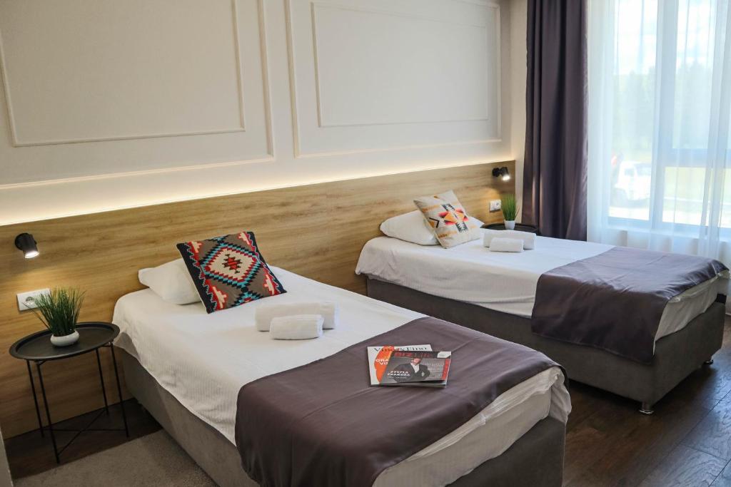 Postel nebo postele na pokoji v ubytování Hotel Dijana