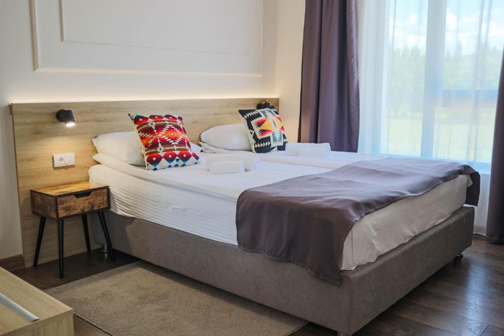 Postel nebo postele na pokoji v ubytování Hotel Dijana