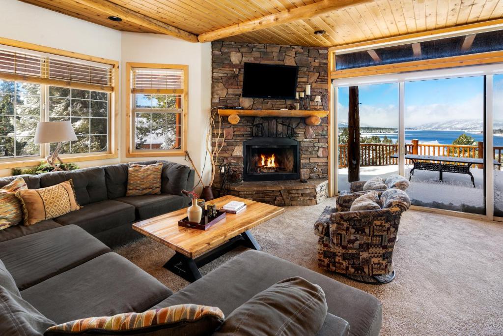 a living room with a couch and a fireplace at 59 - Lakeview Lodge home in Big Bear Lake