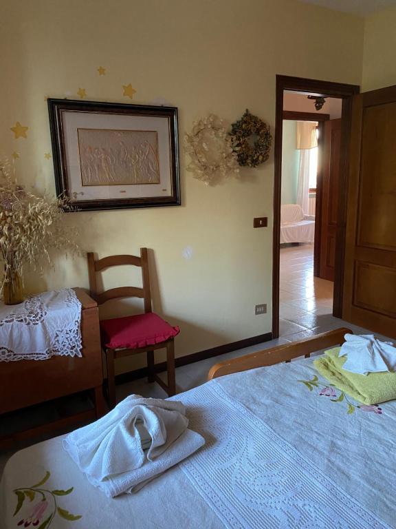 A bed or beds in a room at IL NIDO DI RONDINE