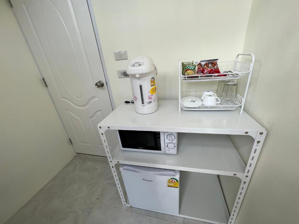 Kuchyň nebo kuchyňský kout v ubytování Pada Guesthouse Khaoyai