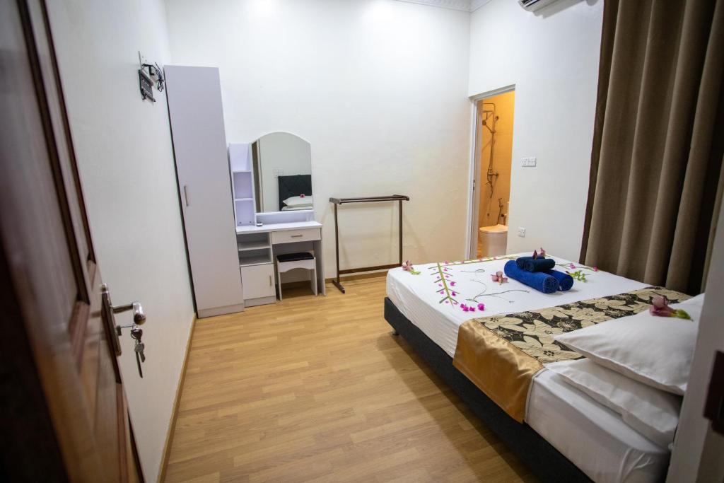 Postel nebo postele na pokoji v ubytování iHaven Thulusdhoo